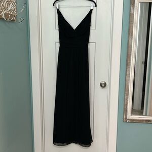 Formal black chiffon dress with twist back.